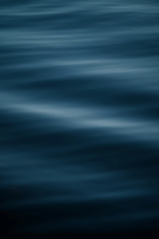 the waves of water can be seen with blue hues