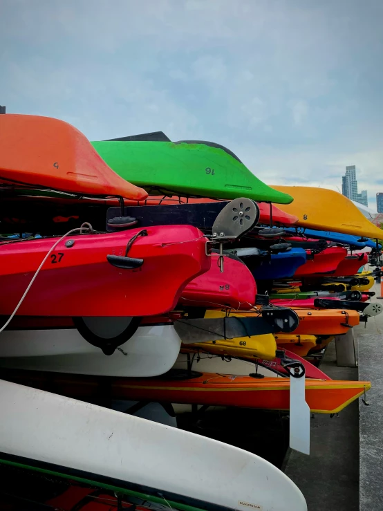 a line up of canoes parked next to each other