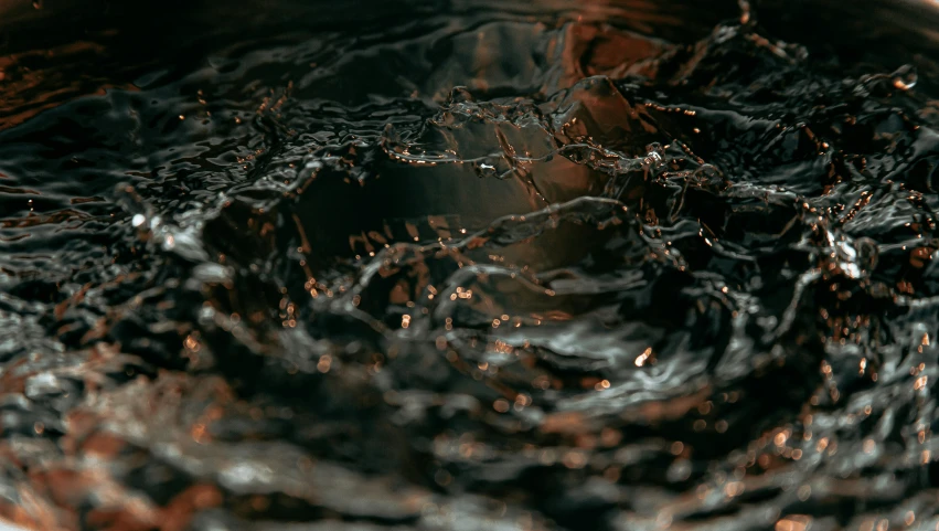 water is rising from the bottom of a bowl