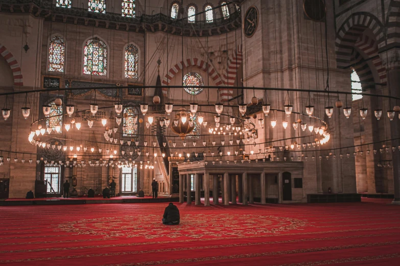 the inside of a large building with stained glass