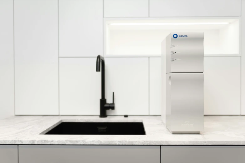 a modern kitchen with white and black cabinets