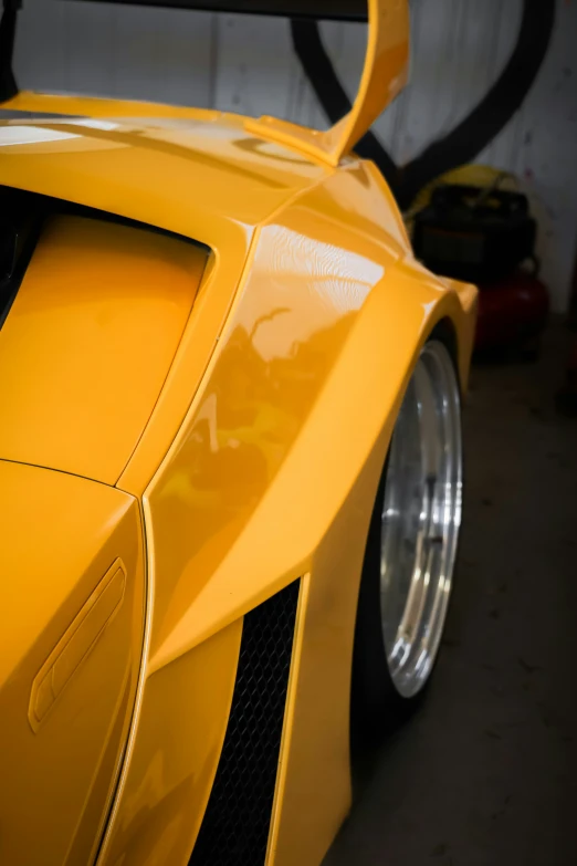 a yellow lamb car parked in a garage