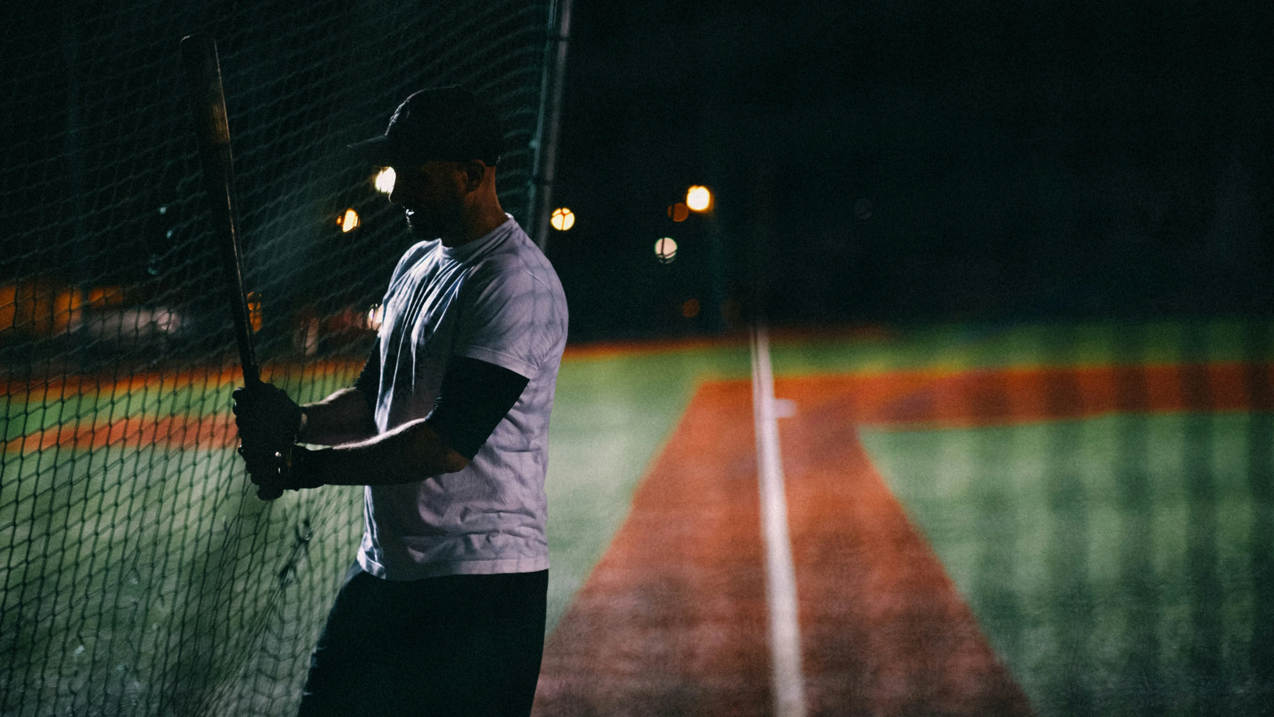 a man on a tennis court holding a tennis racquet