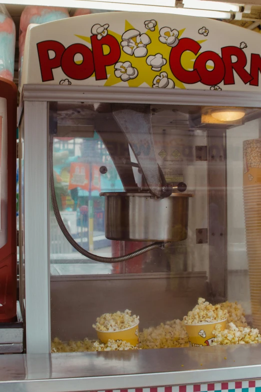 popcorn and drink in a popcorn dispenser