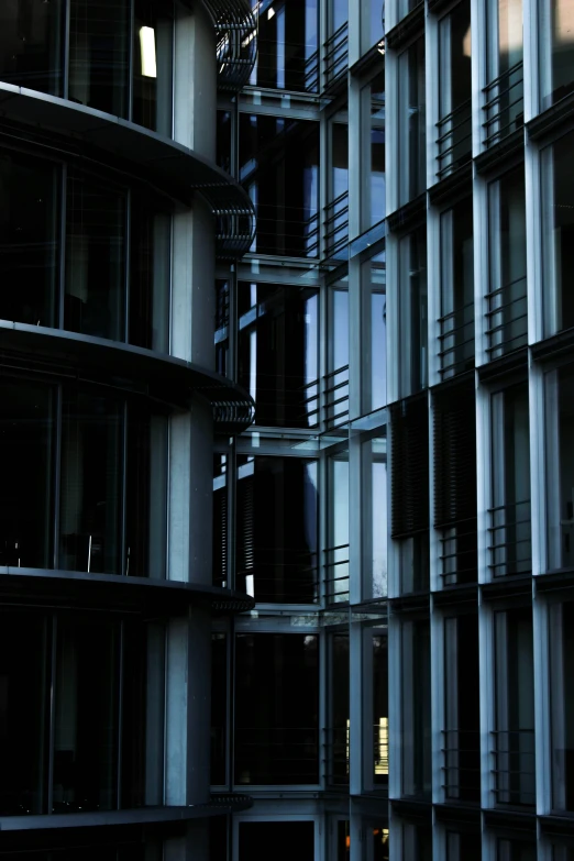 the side of a building with balconies and a traffic light