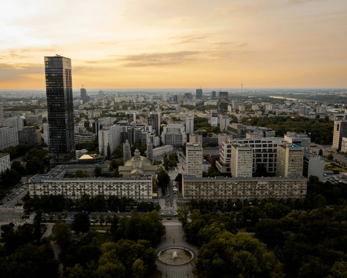 an aerial view of a city with trees and buildings