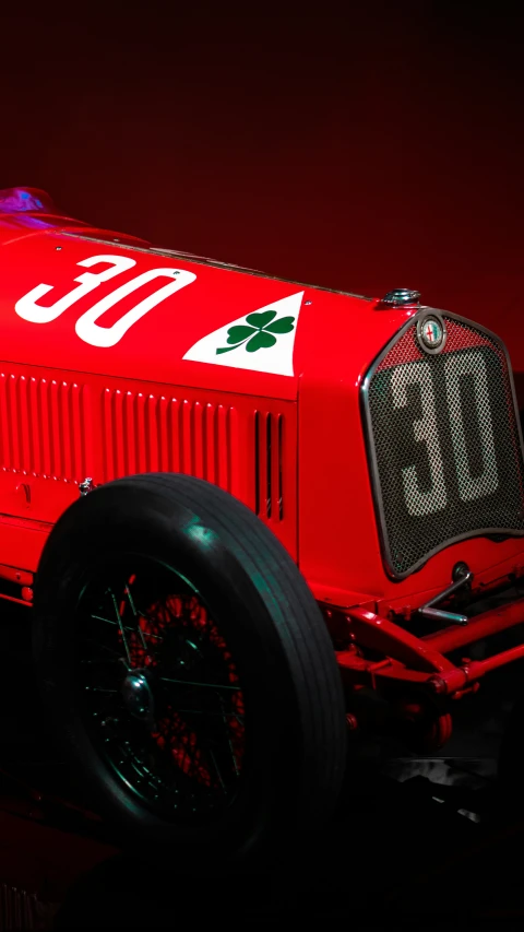 an old fashioned fire engine on display in the dark