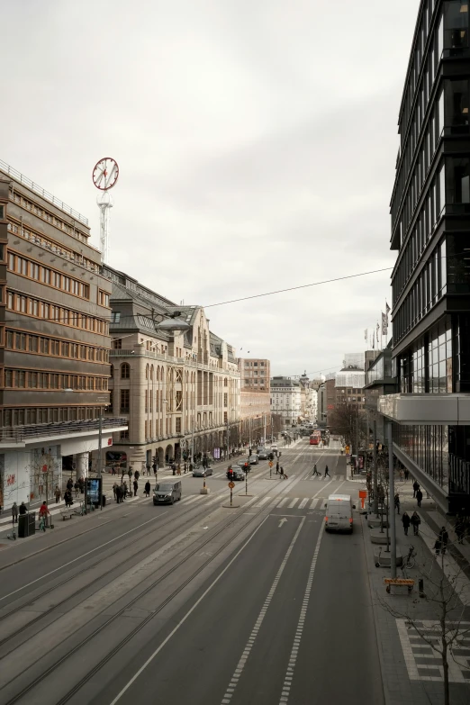 a city street filled with lots of traffic and tall buildings