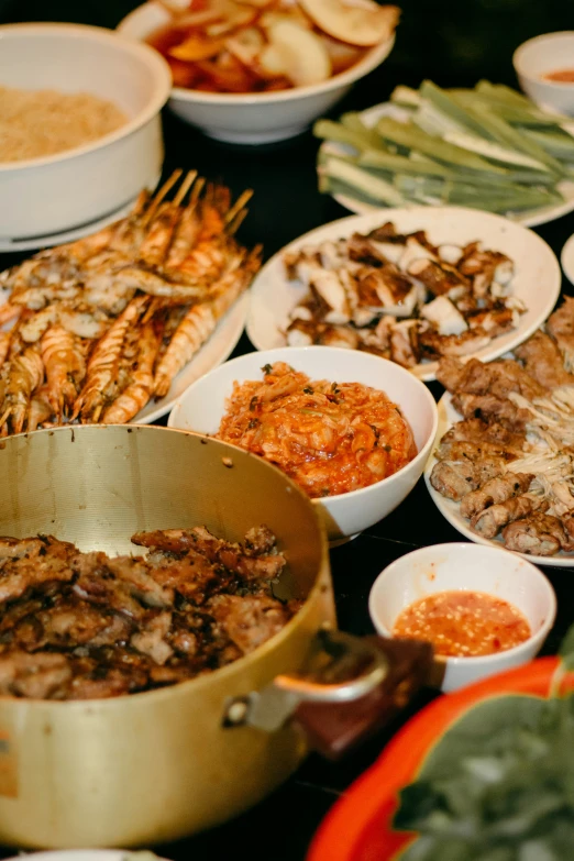 various dishes of food in a pan and on plates