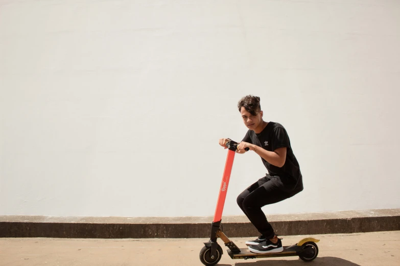 a man riding on the back of a scooter