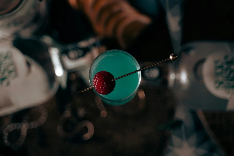 a blue drink is sitting on a table