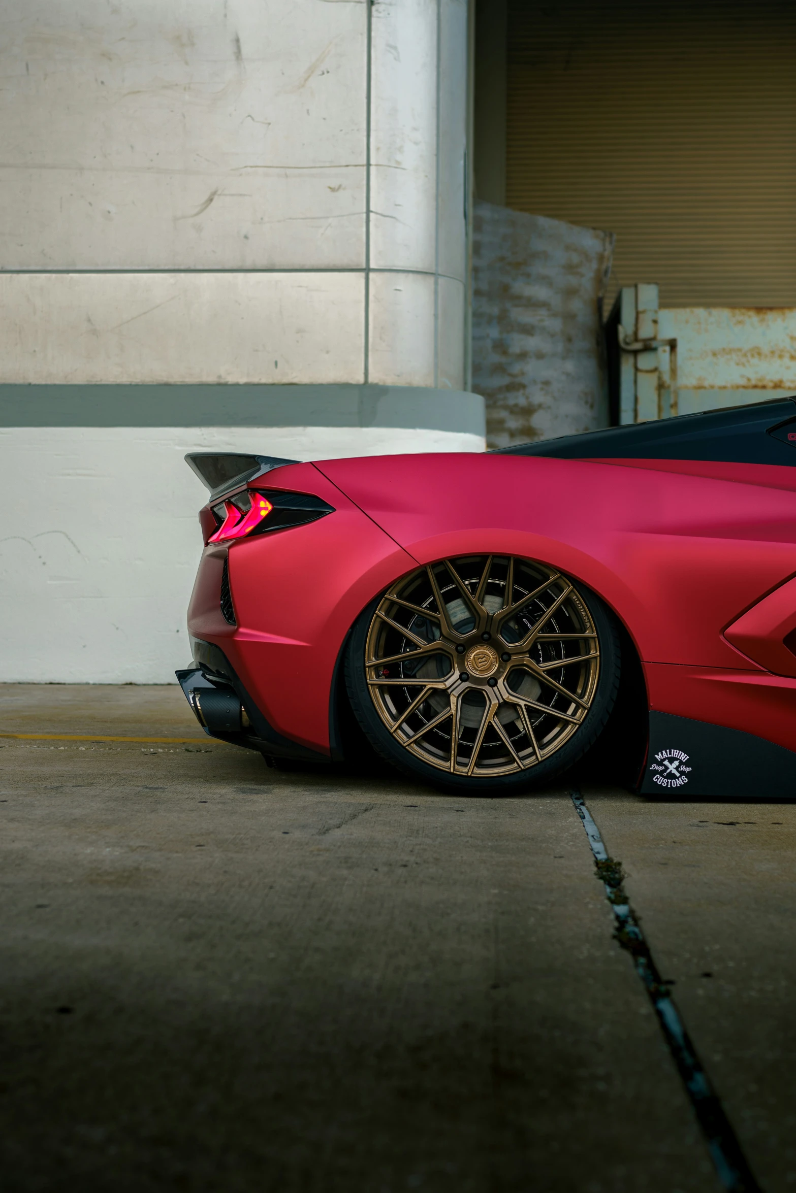 a red sports car parked outside of a building