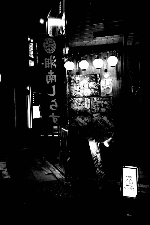 a person standing next to a wall with lights on