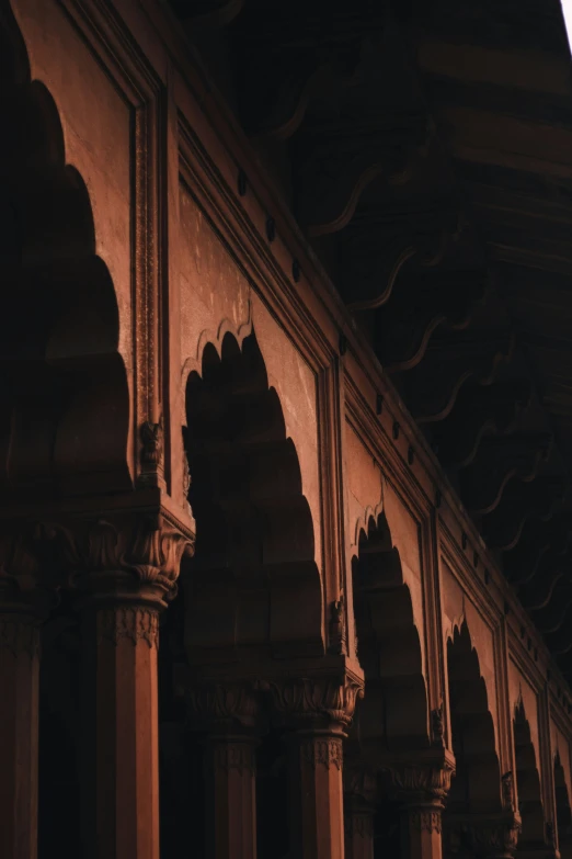 an abstract pograph of a wall with arches and pillars