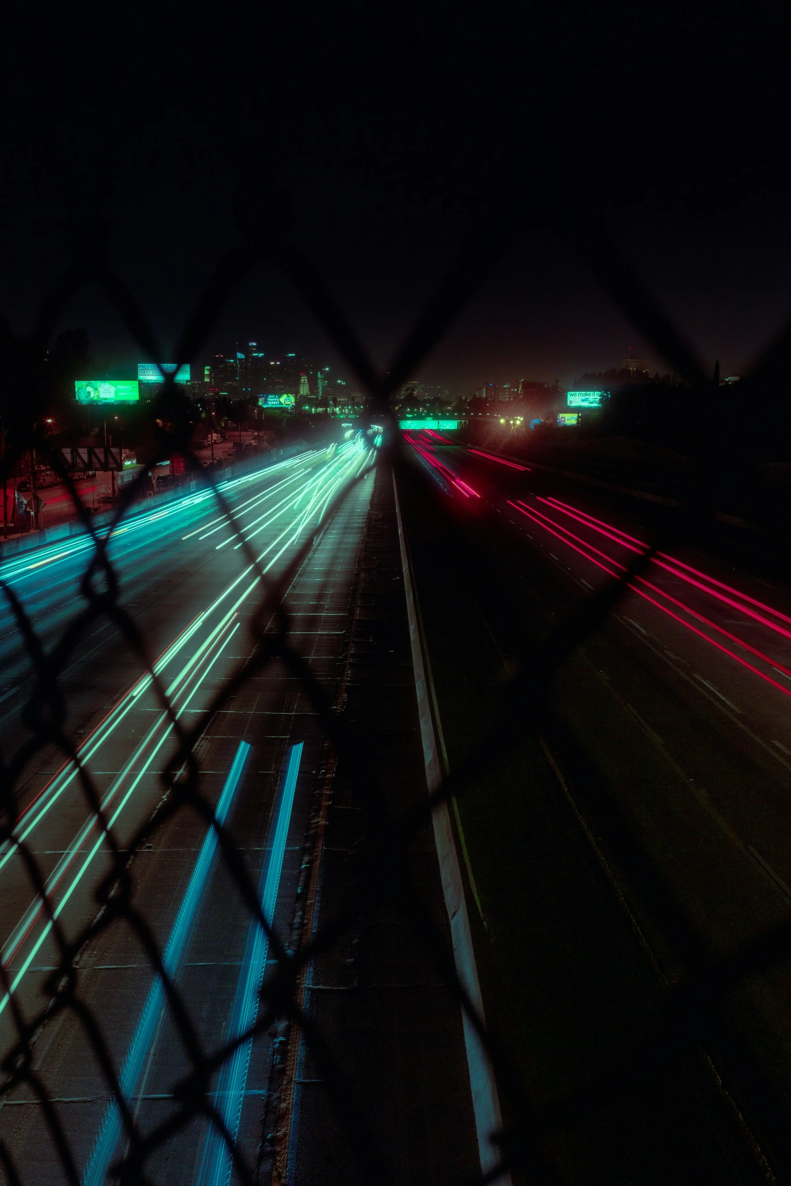 the lights are glowing at night and very long lines