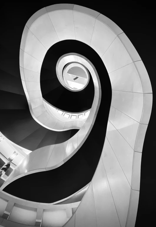 stairs are shown from below in this black and white image