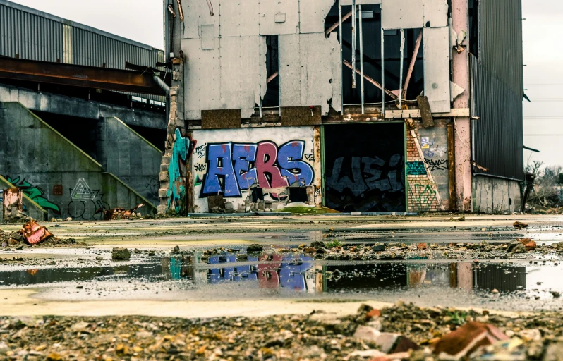 an abandoned warehouse building with a graffiti and tagging