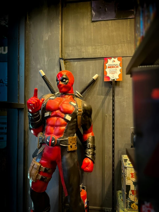 a man dressed as deadpool standing on the street