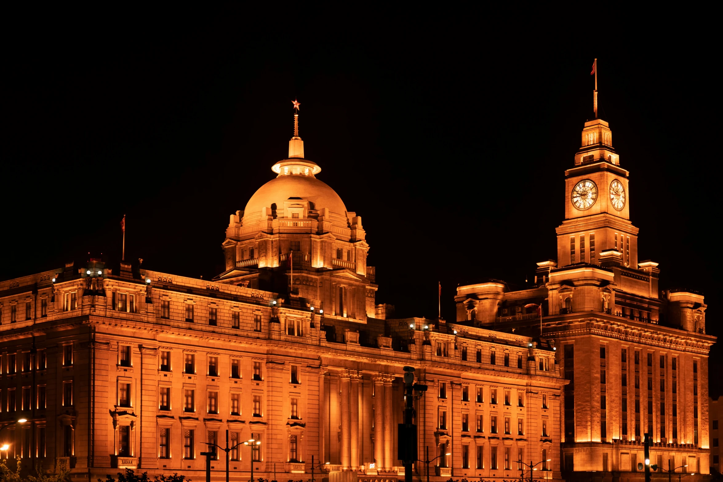 an old looking building lit up at night