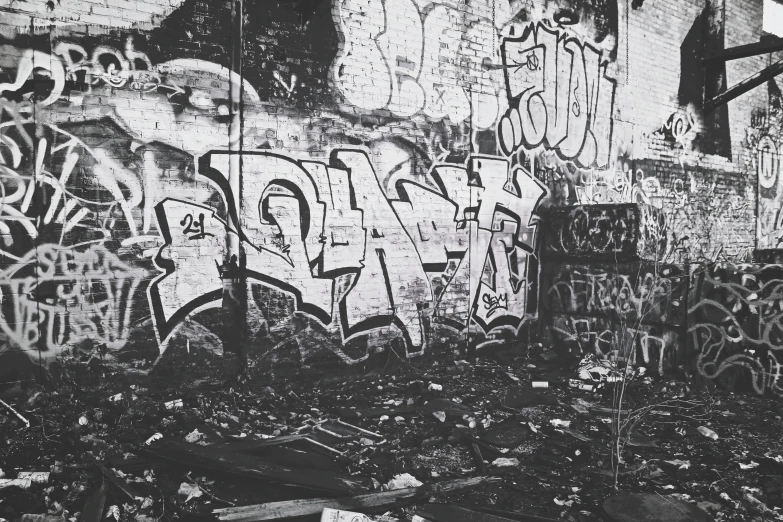 a black and white po of graffiti on a wall