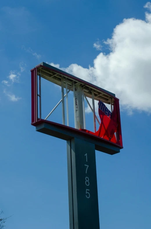 an airplane in the air under blue skies with a clock