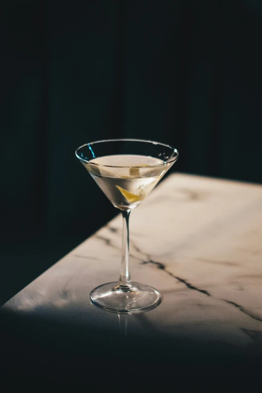 a martini in the middle of a glass of alcohol