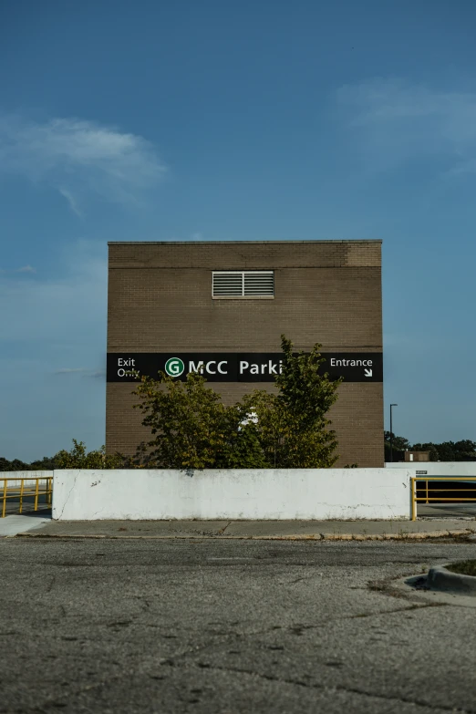 this is an empty parking lot in front of an mcc park building