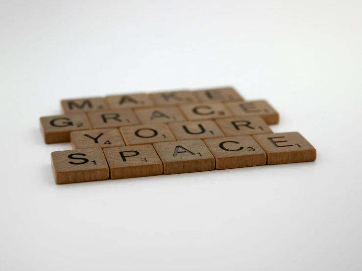 some scrabble type letters on a white background