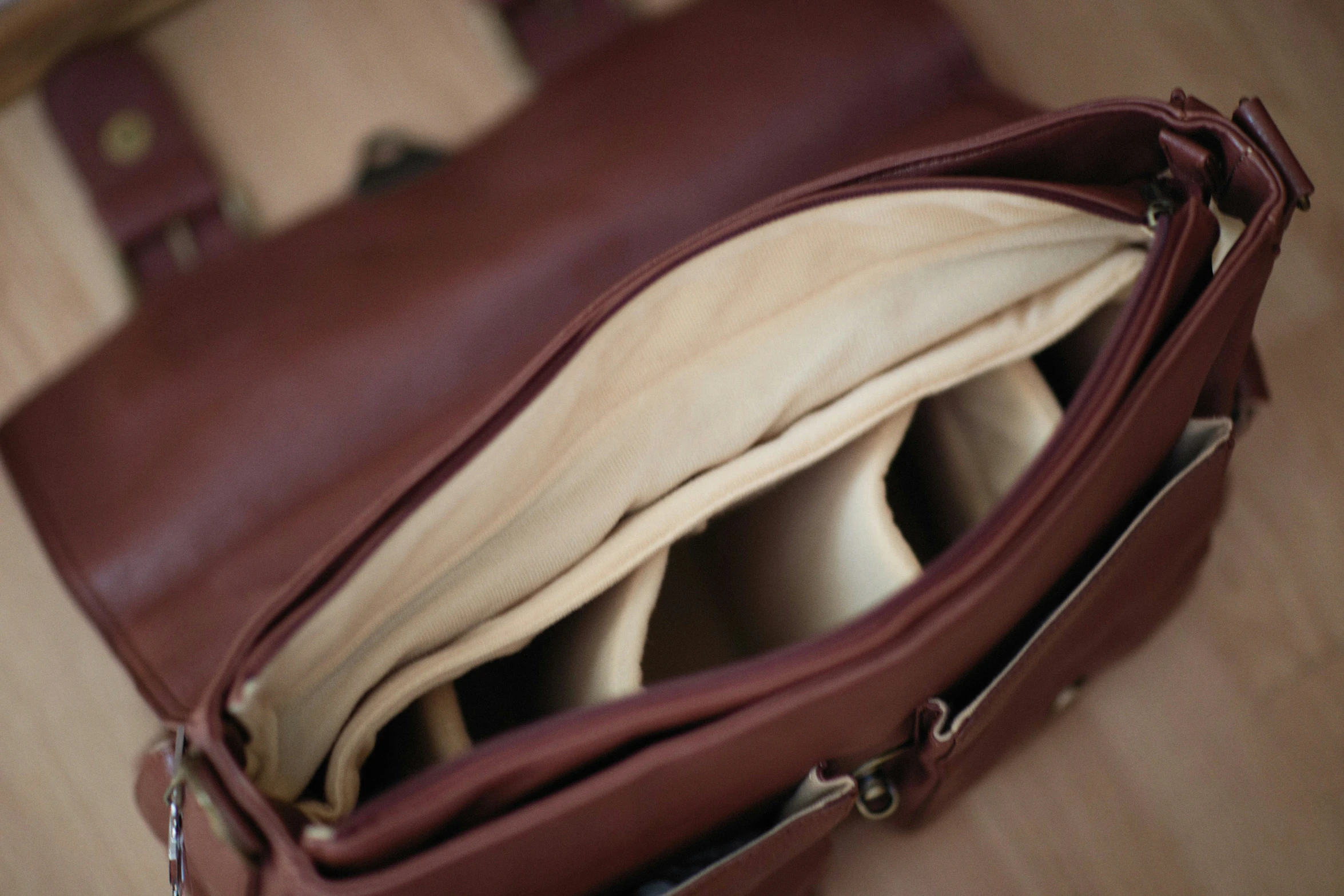 an open brown purse on top of a table