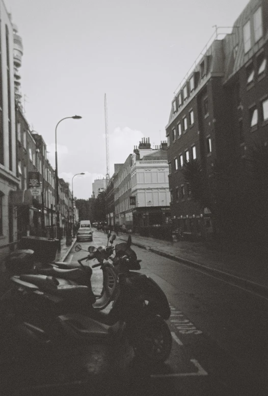 a couple of motorcycles driving down a street