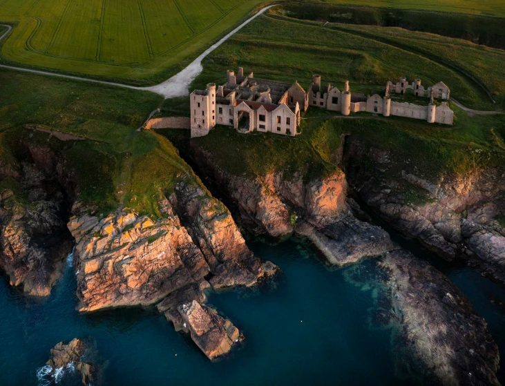 the aerial view of the castle at sunrise