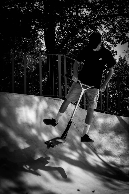 a skateboarder jumping off a ramp in a park