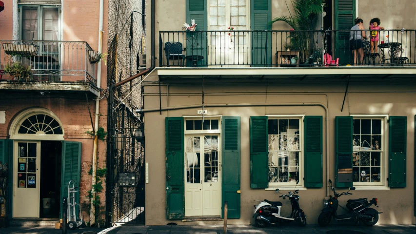 a couple of scooters are parked outside of a house