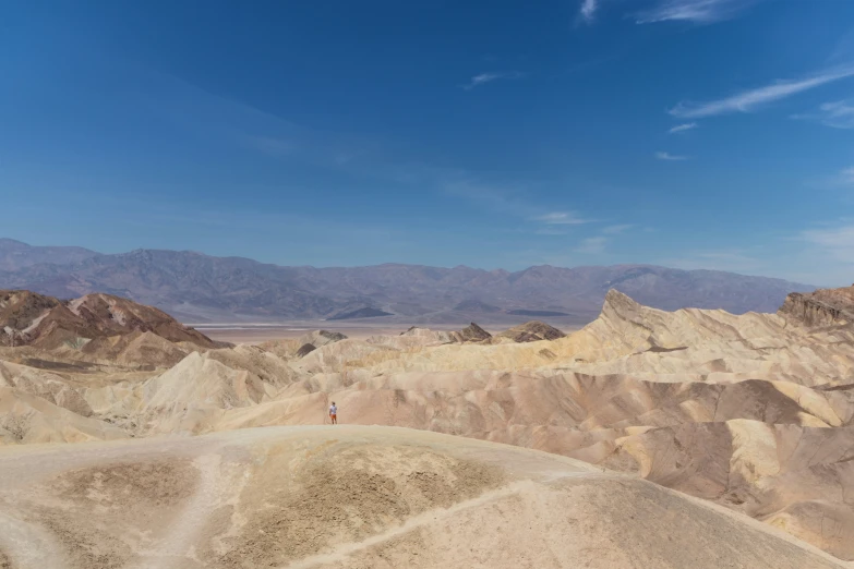 several hills with sand mountains in the background