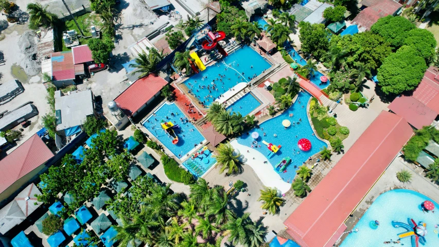 an aerial view of a swimming pool, in the middle of an island