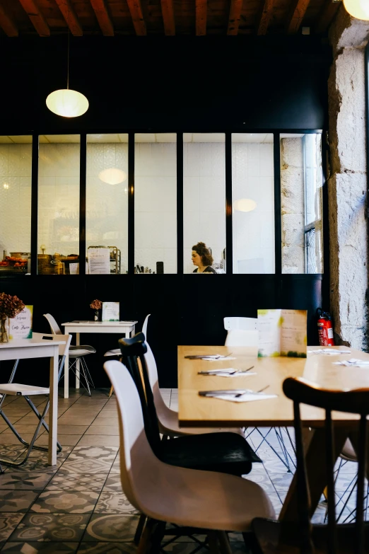 a restaurant with tables and chairs around it