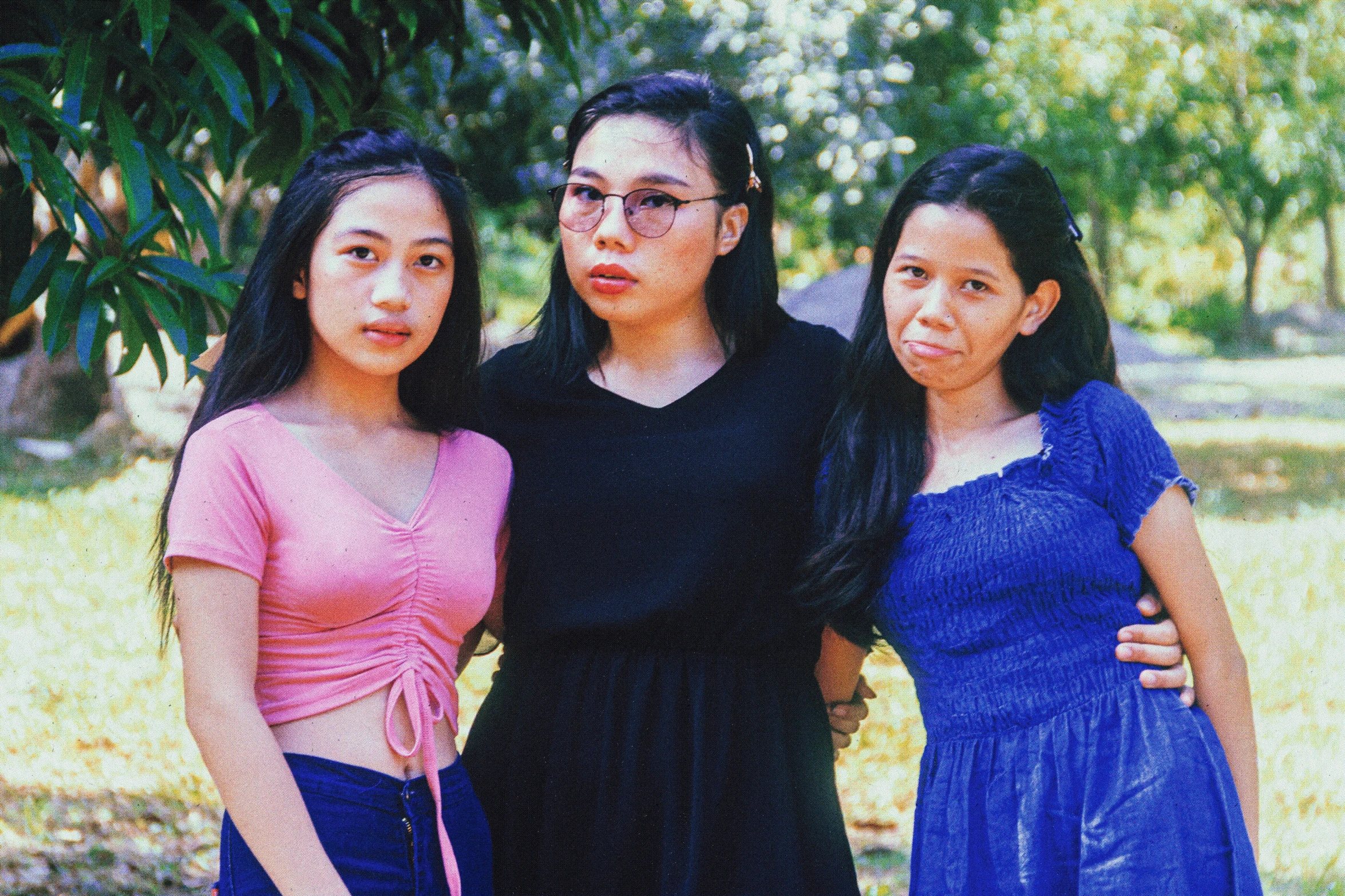 four women are posing for a po