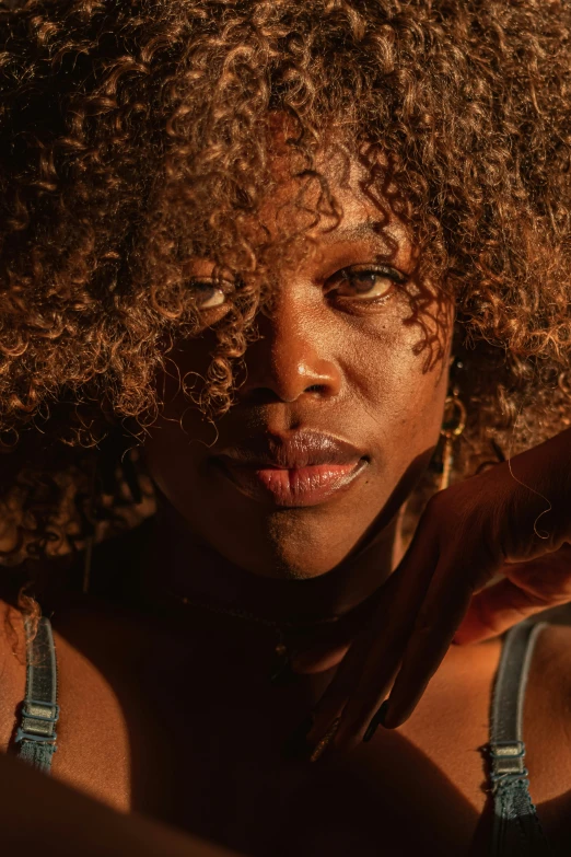 a woman with an afro and large curls