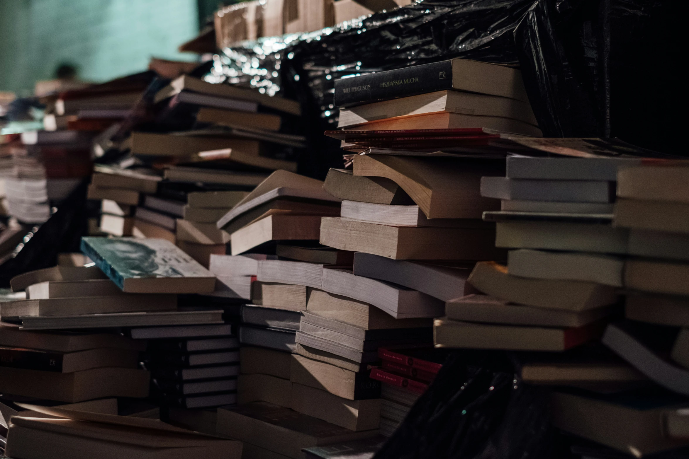 a bunch of books that are stacked together