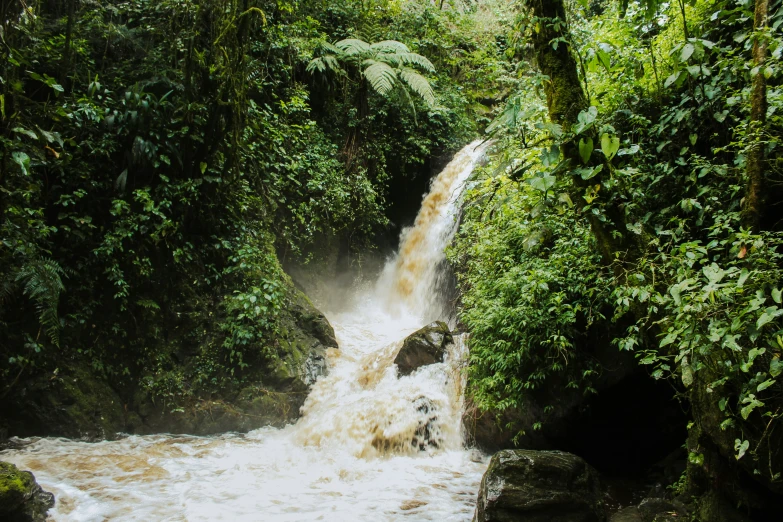 a large waterfall with lots of water on it