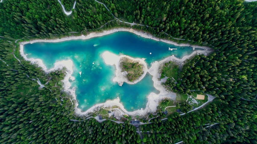 the beautiful blue pond surrounded by forest