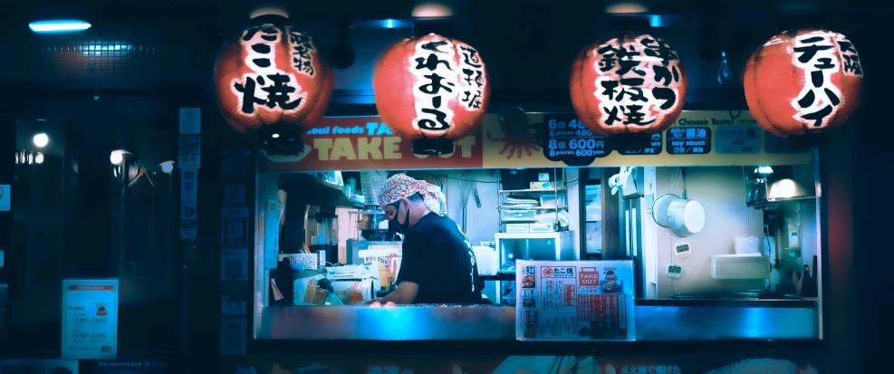 a couple of signs are over a customer in a restaurant