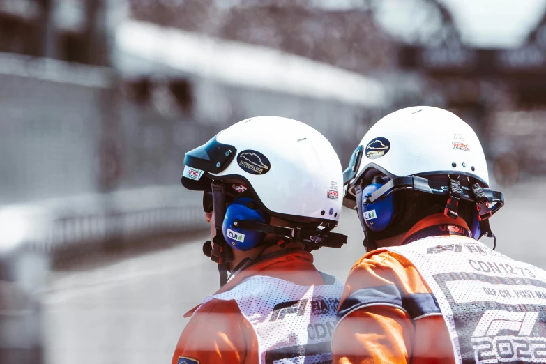 a couple of people with helmets on