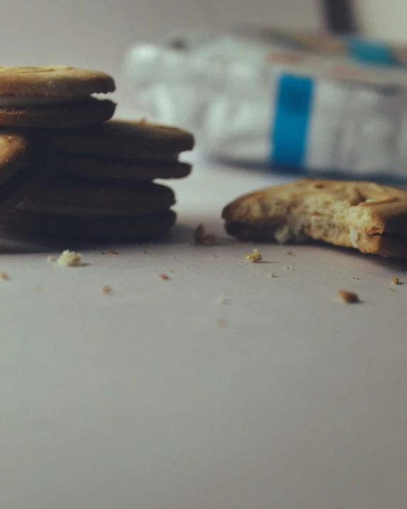 four cookies with one broken and half eaten