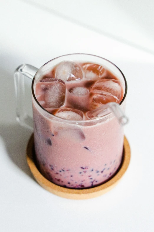 an iced drink in a glass with ice cubes on top