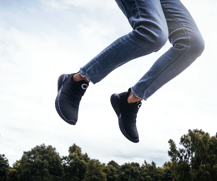 a person with sneakers flying through the air