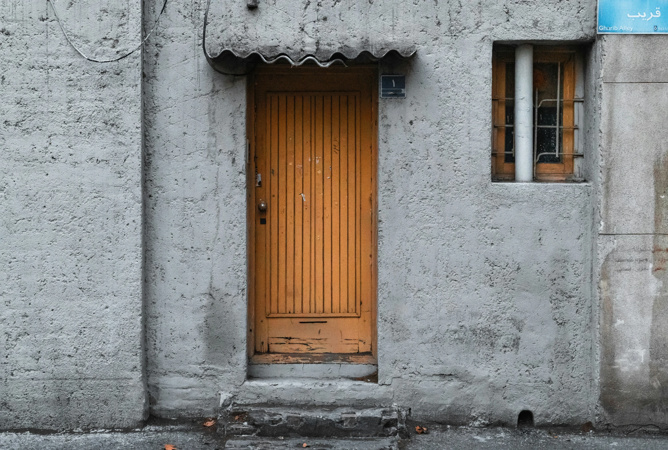 a small wooden door is shown in a stone building