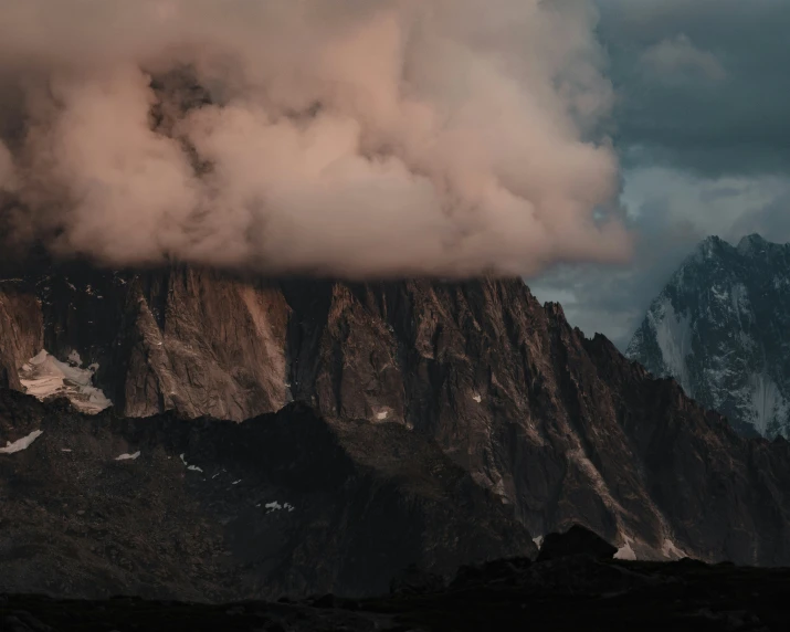 a large mountain covered in a thick cloud