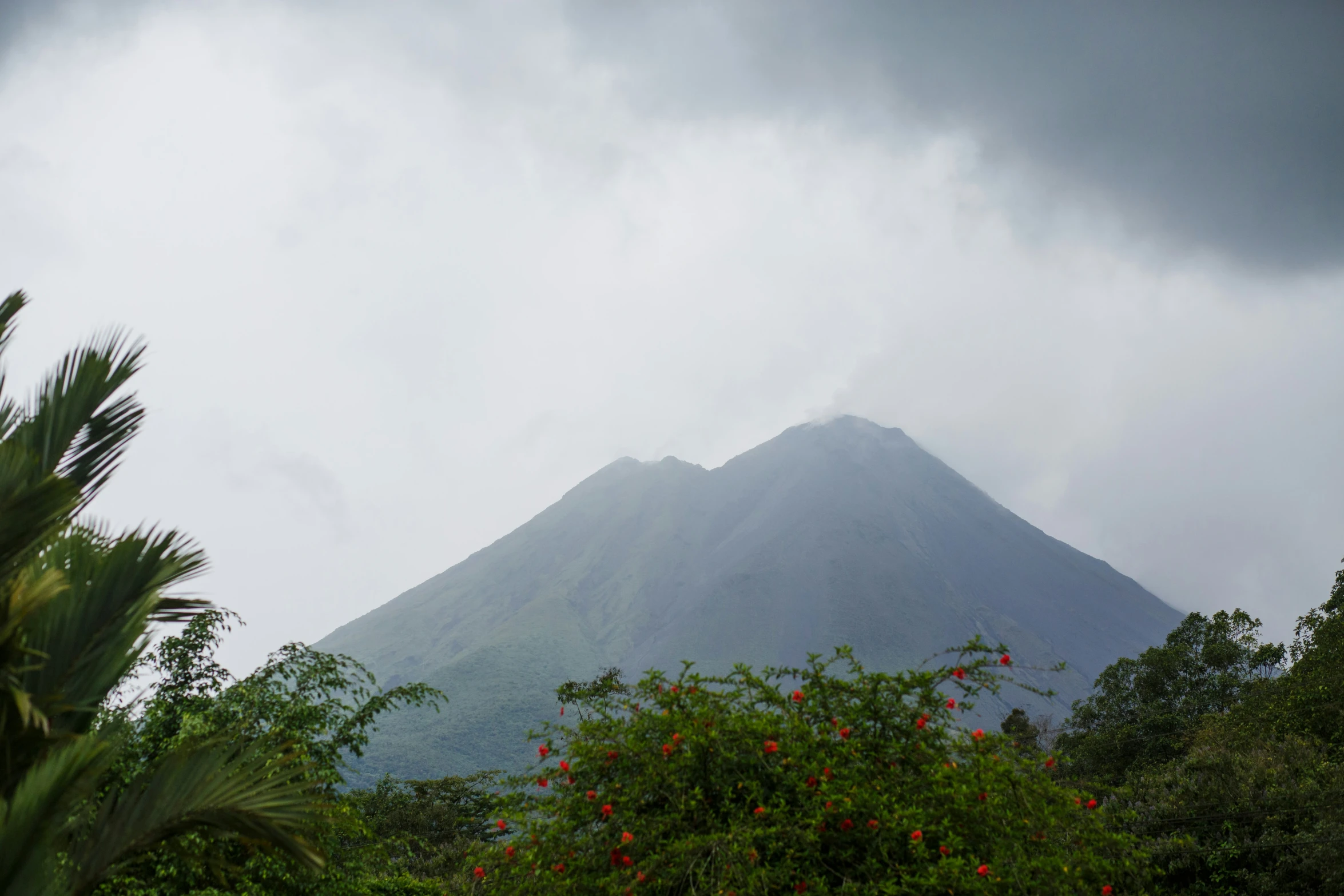 a mountain and the clouds are over it