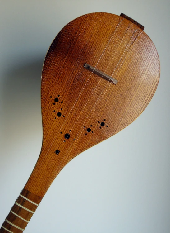 an up close s of a wooden clock on the wall